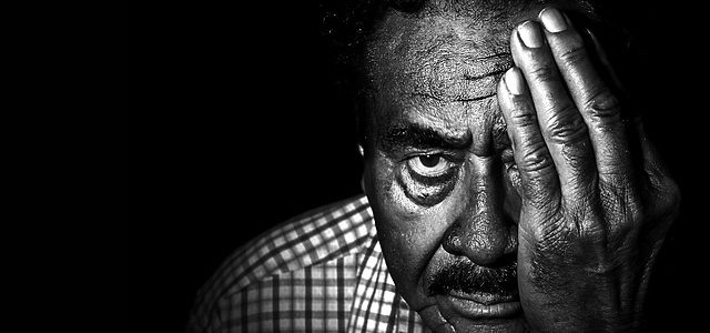 How to Improve Eyesight Without Glasses Man covering eye to do eye exercises